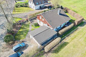 Luftaufnahme Front-/Seitenansicht - Einfamilienhaus mit 176,00 m² in Beverstedt zum Kaufen