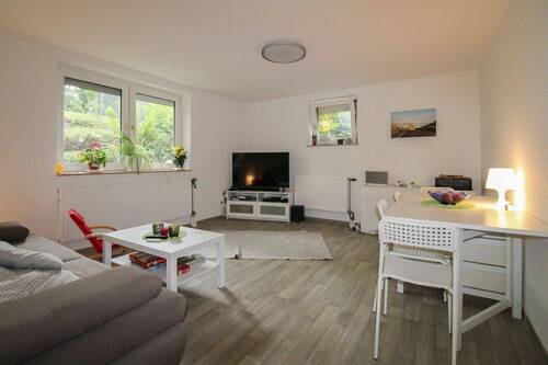 Wohnzimmer EG - Mehrfamilienhaus, Wohnhaus mit 170,00 m² in Hatten zum Kaufen