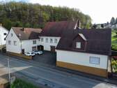 Frontansicht - 1 Zimmer Mehrfamilienhaus, Wohnhaus zum Kaufen in Kottweiler-Schwanden