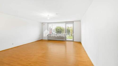 Wohnzimmer 1 - Moderne Erdgeschosswohnung mit großzügigem Grundriss und zwei Terrassen