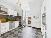 Küche mit Zugang Balkon - Etagenwohnung mit 129,00 m² in Wiesbaden zum Kaufen