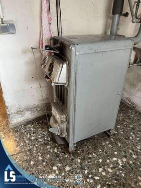 Heizkessel für Holz und Briketts in die Heizungsanlage integriert - 