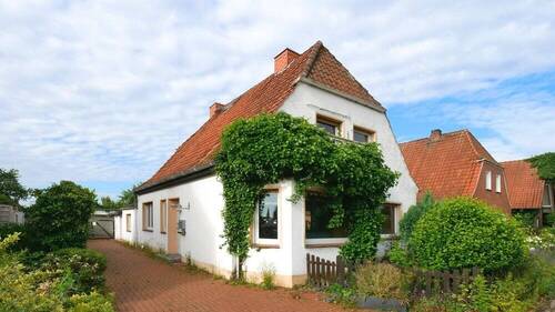 V1592 Ansicht Straße Bild 1 - Einfamilienhaus mit Potenzial in Twistringen