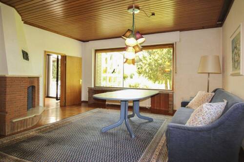 Wohnzimmer mit Panoramafenster - Einfamilienhaus mit 240,00 m² in Porta Westfalica zum Kaufen