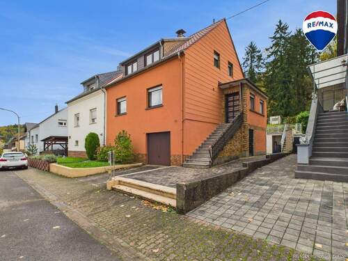 RE/MAX Immobilien DeLux Einfamilienhaus Körprich Seitenansicht - 
