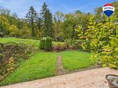 RE/MAX Immobilien DeLux Einfamilienhaus Körprich Gartenansicht - 