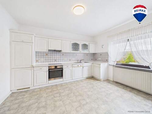 RE/MAX Immobilien DeLux Einfamilienhaus Körprich Küche - 