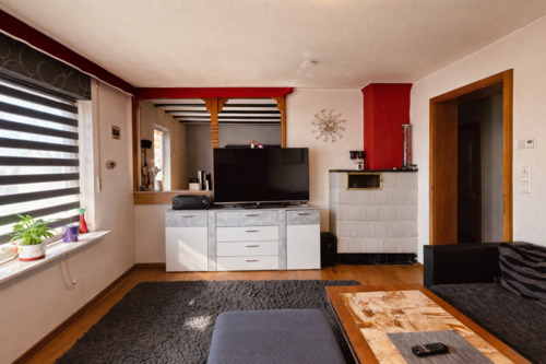 Wohnzimmer mit Kachelofen - 