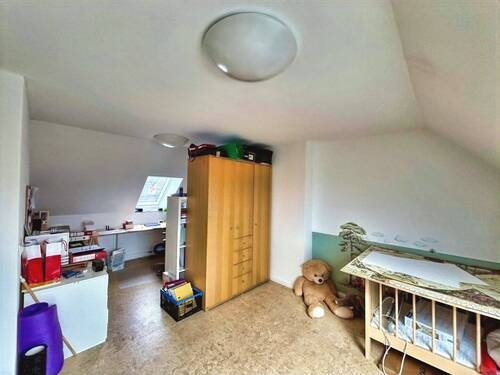 Zimmer im Dachgeschoss - 