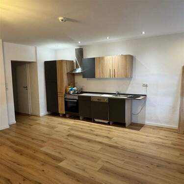 Wohnzimmer mit Küchenzeile - 2 Zimmer Etagenwohnung zur Miete in Borgentreich