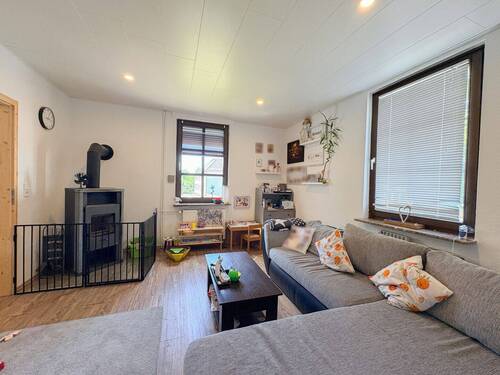 Wohnzimmer mit Kamin (EG) - 