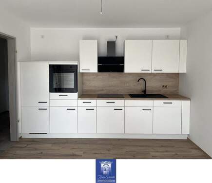 EBK - Wohlfühlwohnung mit Terrasse und moderner Ausstattung im Erstbezug! Rollstuhlgerecht!