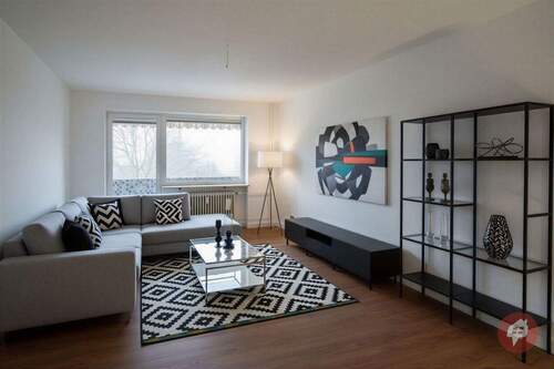 Wohnzimmer - (KI generiert) - Neu sanierte 2-Zimmer-Wohnung mit Balkon und Blick ins Grüne