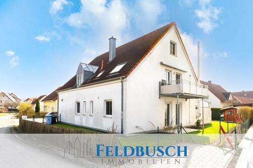 Cover Logo - 4-Zimmer-Erdgeschosswohnung mit Garten und Garage - Wohnen wie im Haus