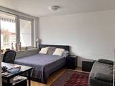 Schlafzimmer mit Arbeitsbereich - 