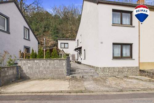 REMAX Immobilien DeLux Haus in Losheim am See - Britten zu verkaufen - Charmantes Einfamilienhaus in ruhiger Lage in Britten