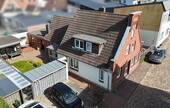 Luftbild - 6 Zimmer Mehrfamilienhaus, Wohnhaus zum Kaufen in Heide