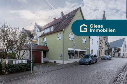 Titelbild mit Banner - Attraktives Wohn- und Geschäftshaus im Herzen Degerlochs