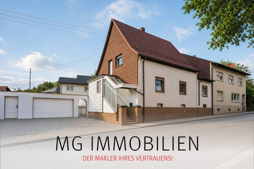 Außenansicht - MG - Solides Einfamilienhaus mit Doppelgarage, Garten & Potenzial in zentraler Lage von Spesbach