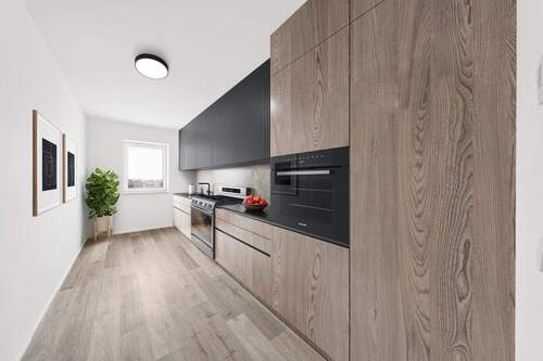 Einrichtungsbeispiel Küche - Über den Dächern: 4 Raum Wohnung: Neubau-Traum mit Südbalkon Energie-Effienzklasse A+