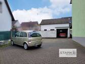Außenansicht Garage und Stellflächen.jpg - Mehrfamilienhaus, Wohnhaus mit 264,70 m² in Kist zum Kaufen
