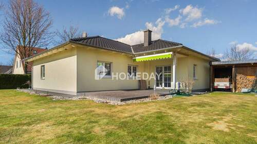 Außenansicht 1 - Attraktives Einfamilienhaus mit 4 Zimmern, Kamin und Garten mit Terrasse - perfekt für Familien