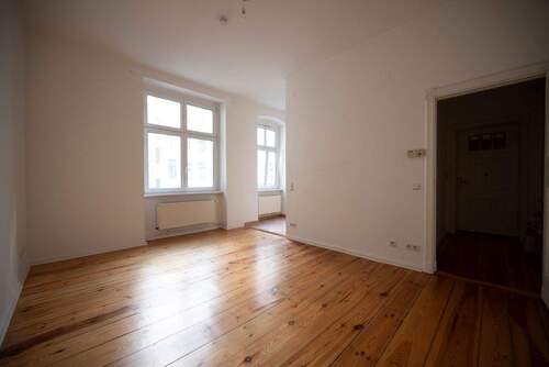 Wohnzimmer mit Einbauküche - 