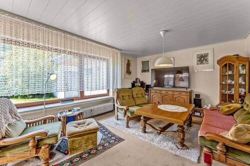 Wohnzimmer - Einfamilienhaus mit 101,00 m² in Wulsbüttel zum Kaufen