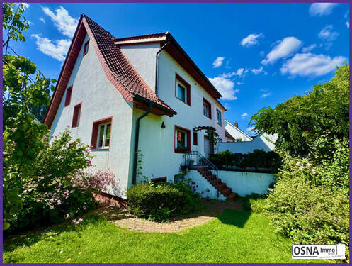 Gartenansicht - Modernisierte Haushälfte mit idyllischem Garten