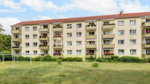 Außenansicht 3 - Sonnige 3-Zimmer-Wohnung mit Balkon, Garten & zentraler Lage - gepflegter Zustand