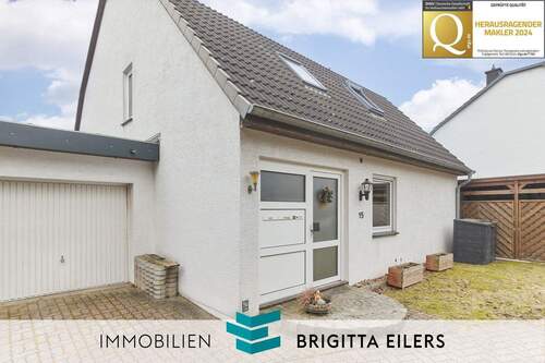 Bild 1 - Bungalowatmosphäre im Zweiparteienhaus - Moderne Erdgeschosswohnung mit Terrasse, Garten und Garage!