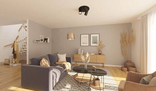 Das Wohnzimmer wird durch bodentiefe Fenster hell - 