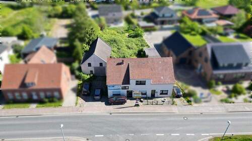 Bild 2 - 8 Zimmer Mehrfamilienhaus, Wohnhaus zum Kaufen in Butjadingen