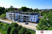 Drohnenansicht Süd-Ost - Barrierefreie 4-Zimmer Neubauwohnung im EG mit Balkon, TG und ST in wunderschöner Lage!