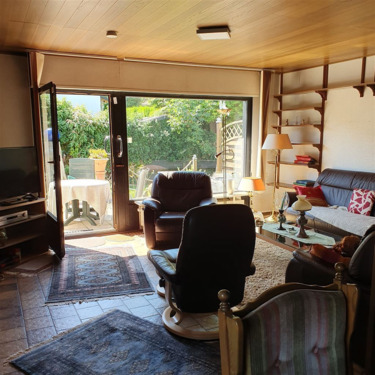 Wohnzimmer mit Zugang in den Garten - Einfamilienhaus mit 169,00 m&sup2; in Maulbronn zum Kaufen