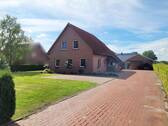 Ansicht Hauseinfahrt - Einfamilienhaus mit 125,00 m² in Filsum zum Kaufen