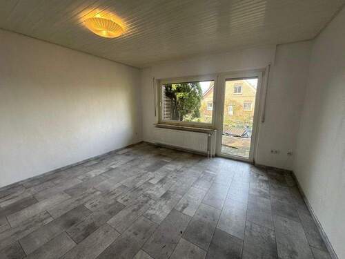 Wohnzimmer WHG-1 - 1 Zimmer Mehrfamilienhaus, Wohnhaus zum Kaufen in Rhauderfehn