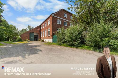 Titelbild - *** RESERVIERT *** Historischer Gulfhof: Stilvolle Eigentumswohnung mit Deichblick