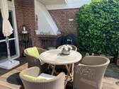 Überdachte Sitzecke mit Kamin - 