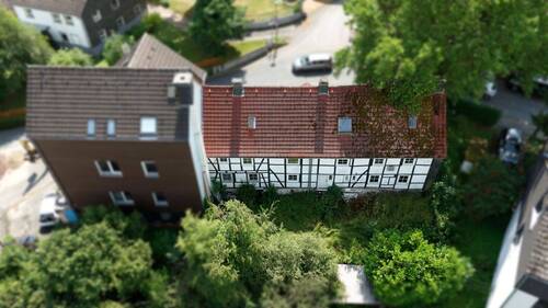 Drohnenansicht 1 - Ihre Chance zum Wohntraum verwirklichen in Hagen-Holthausen: Grundstück mit Altbestand sichern!