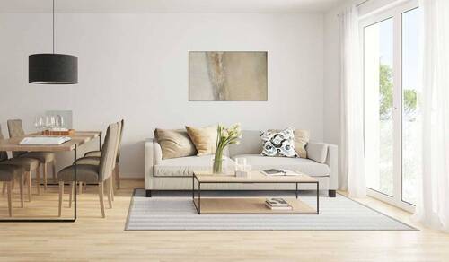 Die bodentiefen Fenster sorgen für viel Licht und Leichtigkeit. - 