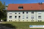 Hausansicht - Geflegte 4-Zi.-Erdgeschosswohnung mit Gartenblick, zwei Kellerräumen und Garagenoption!