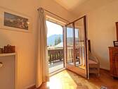 Schlafzimmer mit Zugang zum Balkon - 