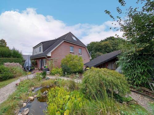 Blick vom Garten auf das Haus - 4 Zimmer Doppelhaushälfte zum Kaufen in Emkendorf