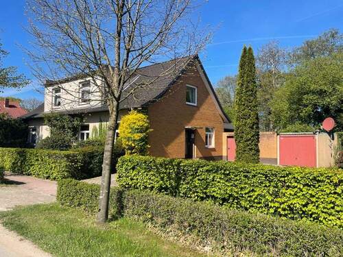 Straßenansicht - Mehrfamilienhaus, Wohnhaus mit 142,00 m² in Schortens zum Kaufen