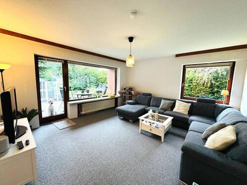 Wohnzimmer mit Zugang zur Terrasse.jpg - Einfamilienhaus mit 130,00 m² in Bad Segeberg zum Kaufen