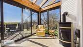Wintergarten mit Kaminofen - 