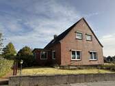 Straßenansicht - Mehrfamilienhaus, Wohnhaus mit 200,00 m² in Molfsee zum Kaufen