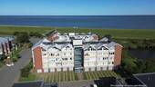 Außenansicht/Luftaufnahme - NUR 150?m bis zur Nordsee - Helle, freundliche Eigentumswohnung mit Garage