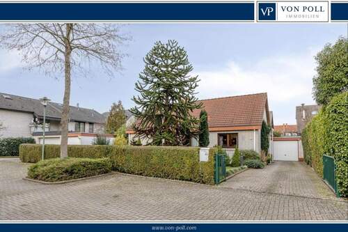 Titelbild - Attraktiver Bungalow mit großzügigem Gartenparadies in Meerbusch-Strümp